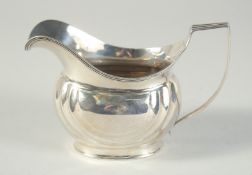 A GEORGE III SILVER CREAM JUG. London 1806. Maker: S. L.& E. D.