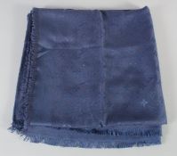 A LOUIS VUITTON NAVY BLUE SHAWL with emblem. 140cm x 160cm.