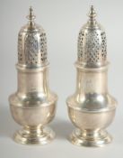 A PAIR OF GEORGE III SILVER SAM WOOD CASTERS. London 1777 & 1779.