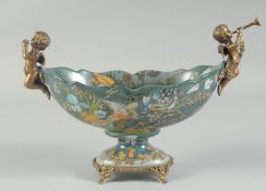 A PORCELAIN AND BRONZE OVAL BOWL with cherub handles. 4ft long.
