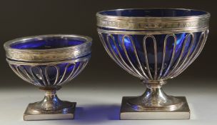 TWO OLD SHEFFIELD PLATE WIRE WORK CREAM AND SUGAR BOWLS with sapphire blue liners.