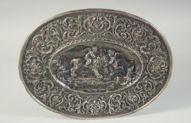 A GOOD CONTINENTAL SILVER OVAL DISH repousse with scrolls, a lion and two cupids. 14ins long, 11.