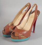 A PAIR OF CHRISTIAN LOUBOUTIN DARK TAN SHOES. Size 37.