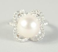 A GOOD 18CT WHITE GOLD PEARL AND DIAMOND RING.