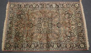 A GOOD PERSIAN RUG floral and scroll design with floral border. 180cm x120cm.