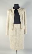 A CHANEL TWO PIECE BOUCEL LADIES SUIT, with ostrich feather trim. Size 40