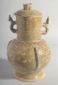 A CHINESE HAN STYLE POTTERY VASE AND COVER, with moulded twin handles, 28.5cm high.