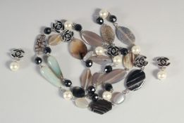 A GOOD LONG CHANEL NECKLACE AND MATCHING EARRINGS with pearl, enamel double C and jewels.