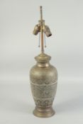 AN ETCHED PERSIAN BRASS LAMP. 26ins high with fittings.