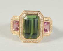 A GOOD 18CT GOLD GREEN TOURMALINE AND DIAMOND RING.