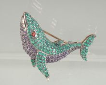 A GOLD AND SILVER DOLPHIN BROOCH.