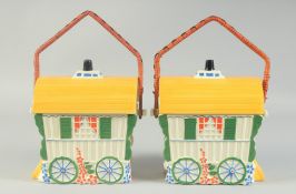 A PAIR OF PORCELAIN GYPSY WAGON BASKETS with wicker handles. 7ins.