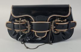 A SMALL FENDI BLACK AND GILT PATENT BAG the front with three buckles. 8ins long, 5ins high.