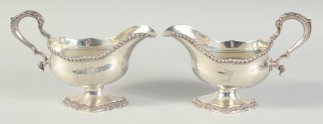 A SUPERB PAIR OF GEORGE III SILVER SAUCEBOATS by JOHN DENZILOE, London, 1779. 7.5ins. Weight: 28ozs.