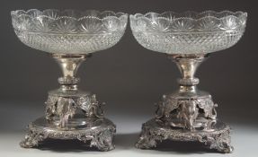 A VERY GOOD PAIR OF SILVER PLATED CUT GLASS TABLE CENTRE PIECES, the bases with elephants,