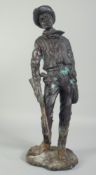 A BRONZE STANDING FIGURE OF A COWBOY. 18ins high.