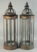 A LARGE PAIR OF COPPER CIRCULAR LANTERNS. 32ins high.