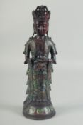 A CHINESE BRONZE AND CLOISONNE ENAMEL GUANYIN FIGURE. 13ins high.