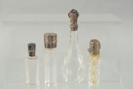 FOUR SILVER TOP SCENT BOTTLES.