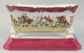 A RECTANGULAR PORCELAIN HUNTING PLANTER on a stand. 1ft 2ins high.
