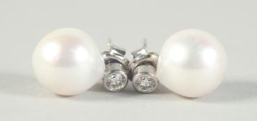 A PAIR OF 18CT WHITE GOLD AND PEARL DIAMOND DROP EARRINGS.