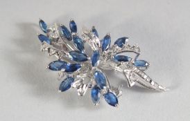 AN 18K WHITE GOLD SAPPHIRE AND DIAMOND BROOCH