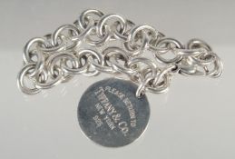 A TIFFANY SILVER BRACELET AND MEDALLION in a Tiffany box.