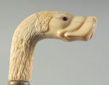 A CARVED BONE HANDLED WALKING STICK 