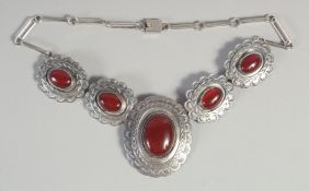 A GOOD STERLING SILVER NECKLACE set with four cabochon stones.