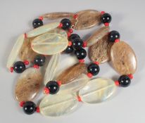 A GOOD CARVED STONE NECKLACE.