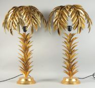 A GOOD PAIR OF GILDED METAL PALM TREE TABLE LAMPS. 28ins high.