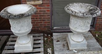 A GOOD PAIR OF CARVED ITALIAN WHITE MARBLE CAMPAGNA URNS ON STANDS. The sides with dancing
