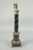 AN EMPIRE BLACK METAL COLUMN LAMP on a square base with claw feet. 24ins high.