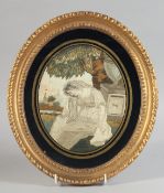 A GILT FRAMED OVAL GEORGIAN SILKWORK PICTURE OF A LADY a pedestal by her side. 