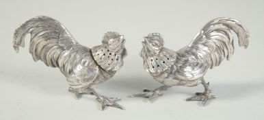A PAIR OF CAST SILVER COCKEREL CASTERS. 3.25ins.