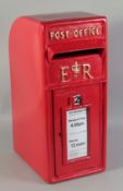 A RED CAST IRON POST BOX.