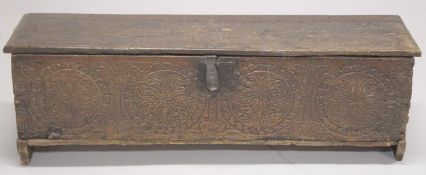 A VERY EARLY POSSIBLY 16TH CENTURY OAK SWORD CHEST with plain plank top and sides. The front with