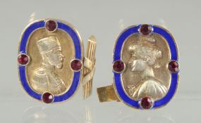 A PAIR OF RUSSIAN SILVER AND BLUE ENAMEL CUFF LINKS with a male and female bust.