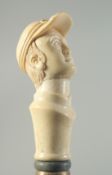 A CARVED BONE HANDLED WALKING STICK 