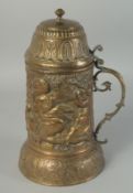A GOOD 18TH CENTURY DUTCH METAL FLAGON repousse with cupids. 1ft high.