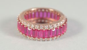 A SILVER PINK AND CZ ETERNITY RING.