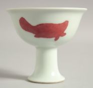A CHINESE COPPER RED AND WHITE PORCELAIN STEM CUP, with six-character mark to base, cup 10cm