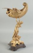 A GOOD GILT BRONZE FIGURE HOLDING A CONCH SHELL with dolphin base. 15ins high.