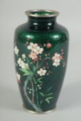 A GOOD JAPANESE GREEN CLOISONNE ENAMEL VASE with flowers. 6ins high.