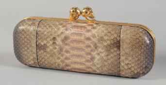 AN ALEXANDER MCQUEEN SNAKESKIN BAG with two gilt scull handles. 9ins long, 3.25ins wide. 170 30079