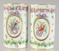 A PAIR OF PORCELAIN SPILL VASES painted with flowers and bow and arrows. 4ins high.