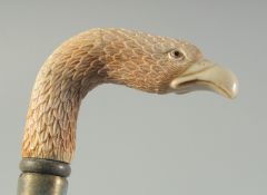 A CARVED BONE HANDLED WALKING STICK 