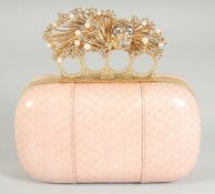 ALEXANDER McQUEEN. A PINK SNAKESKIN SKULL KNUCKLE DUSTER CLUTCH BAG.