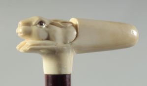 A CARVED BONE HANDLED WALKING STICK 