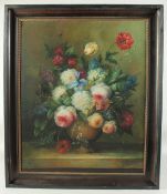J. Gabriel (20th Century), A still life of mixed flowers in a vase on a ledge, oil on canvas,